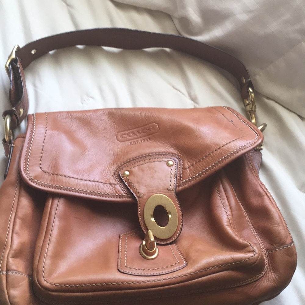 brown leather coach bag, with brass hardware